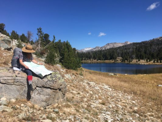 hiker reading map